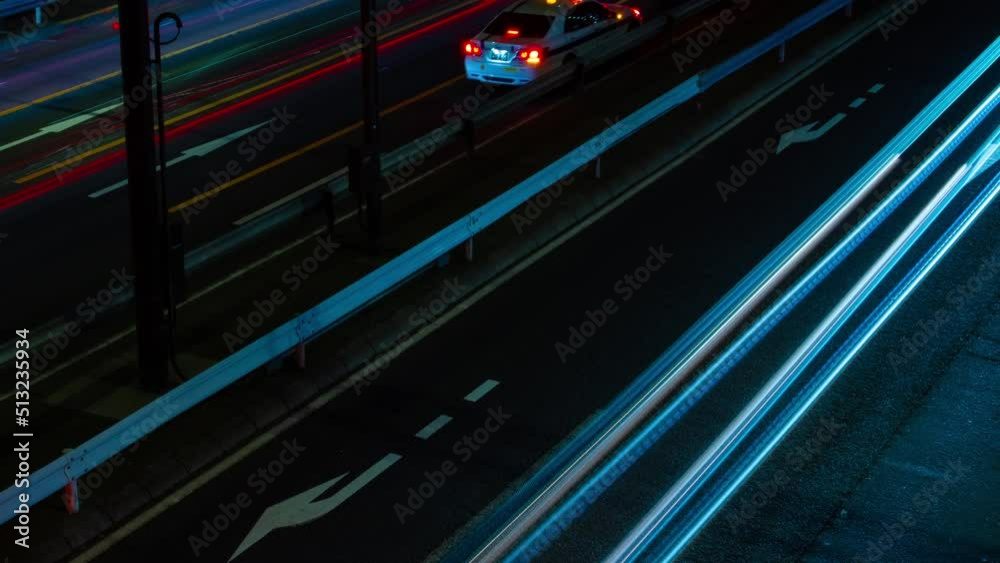 A night timelapse of the traffic on the urban street in Ikejiriohashi long shot A night timelapse of the traffic on the urban street in Ikejiriohashi long shot