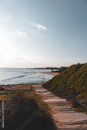 Wooden walkway to the beach in sunny day in Ayia Napa  Cyprus