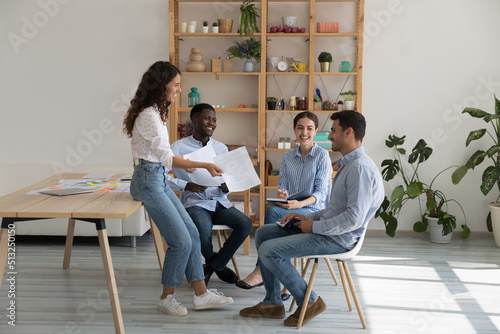 Fotografi Group of cheerful young ambitious multi racial company staff members gather in o