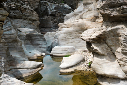 beautiful river and stones in the mountains in the background © SKahraman