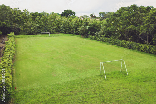 Fototapeta Naklejka Na Ścianę i Meble -  Aerial photo of the soccer field. Green grass. Concept of sport and background.