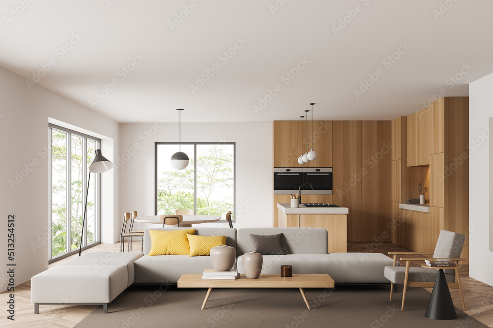 Light kitchen interior with couch and eating area, panoramic window Light kitchen interior with couch and eating area, panoramic window