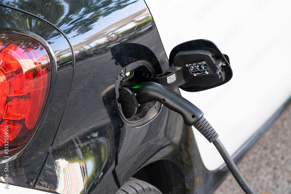 Horizontal shoot of a plug of an electric car charging