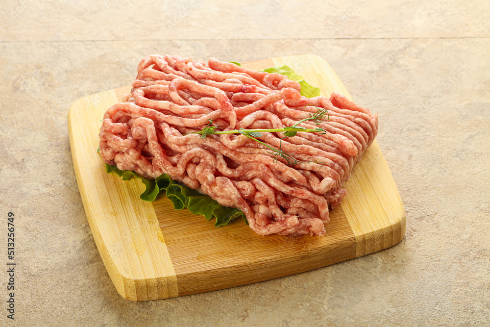 Raw minced pork meat over board Raw minced pork meat over board