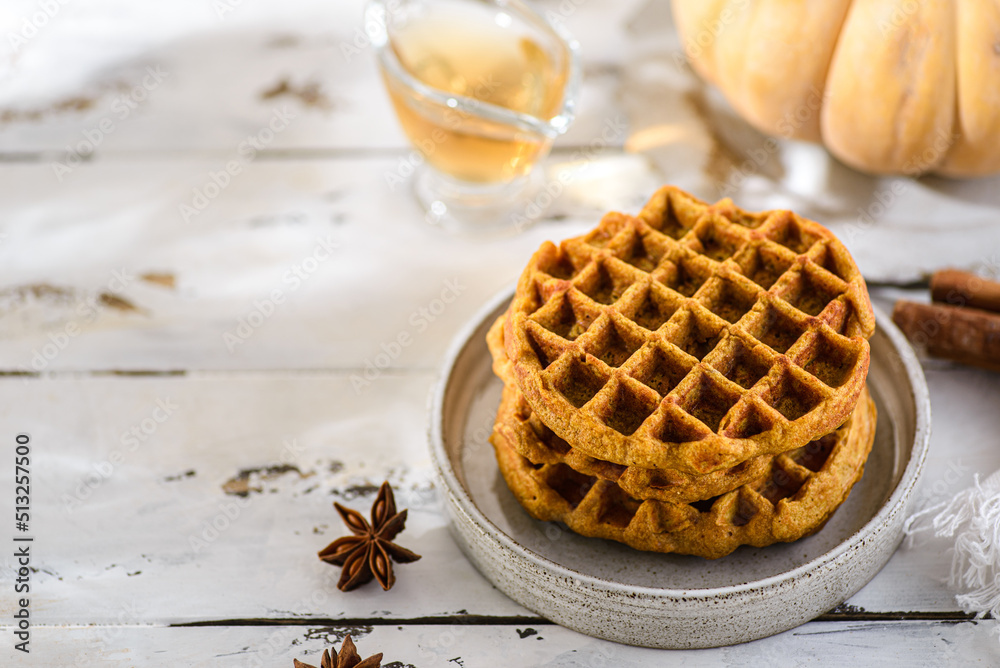 pumpkin waffles on a white wooden background pumpkin waffles on a white wooden background