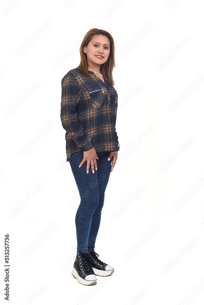 full portrait of a women with jeans and sneaker looking at camera on white background full portrait of a women with jeans and sneaker looking at camera on white background
