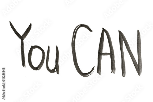 The phrase YOU CAN is drawn with a black brush on white paper.