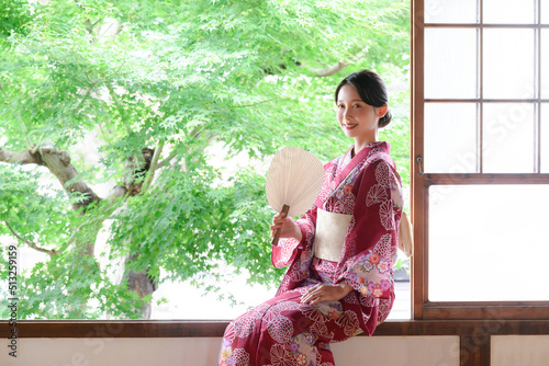 Beautiful Japanese woman smiling in yukata photo