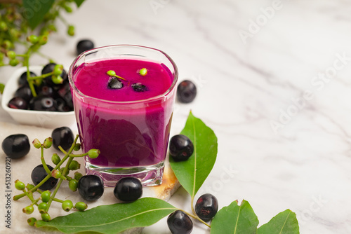 Close-Up of Shake or pulp or juice of Indian Ayurvedic medicinal fresh organic fruit jamun (Syzygium Cumini) with its seeds plum