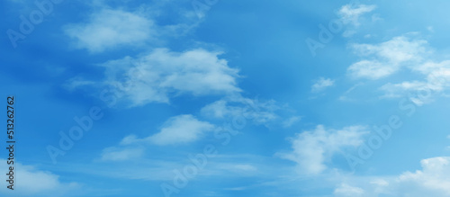Abstract shinny clouds on the blue sky, Cloudy natural summer sky background with tiny clouds for wallpaper, cover, card, decoration and design.