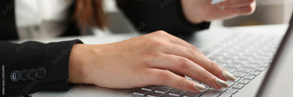 Woman press knobs on keyboard, pay online with credit card, remote shopping on laptop