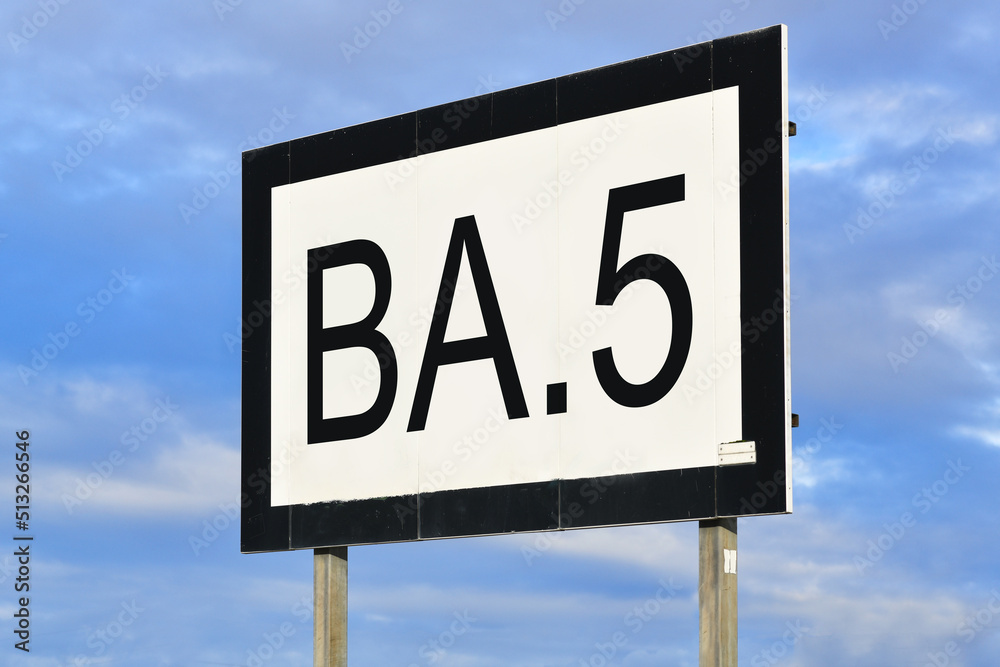 Omicron subvariant BA.5 virus mutation concept with text on billboard Omicron subvariant BA.5 virus mutation concept with text on billboard