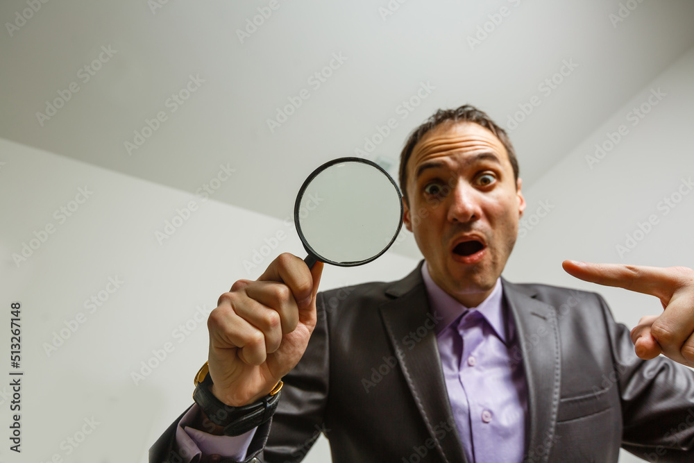Man hand holding magnifying glass. Data search and analysis, conducting research, nuances, important details study, preparation for exams concept Man hand holding magnifying glass. Data search and analysis, conducting research, nuances, important details study, preparation for exams concept