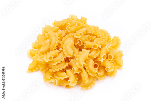 Dried macaroni cockerel scallops. Heap of pasta on white background.