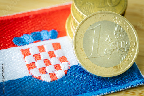 Fototapeta Naklejka Na Ścianę i Meble -  Croatian flag next to the single currency of the European Union, Concept of Croatia joining the eurozone