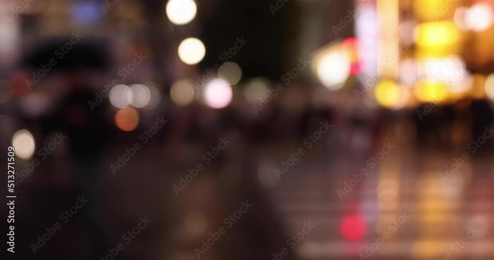 A high speed shooting of defocused walking people at Shibuya crossing rainy day A high speed shooting of defocused walking people at Shibuya crossing rainy day