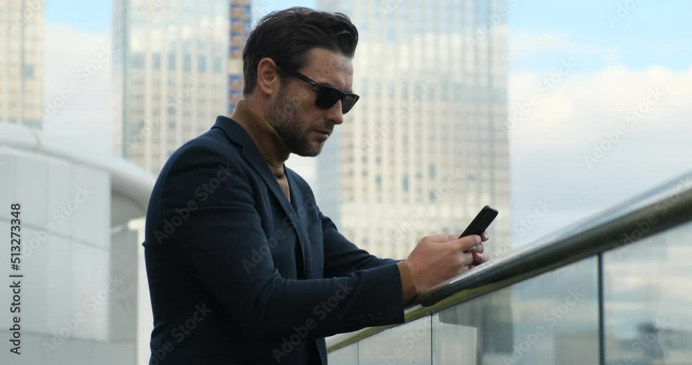 ppy young business man student professional user hold smartphone modern gadget texting message in social media app. businessman in a suit checks the cryptocurrency market in the phone