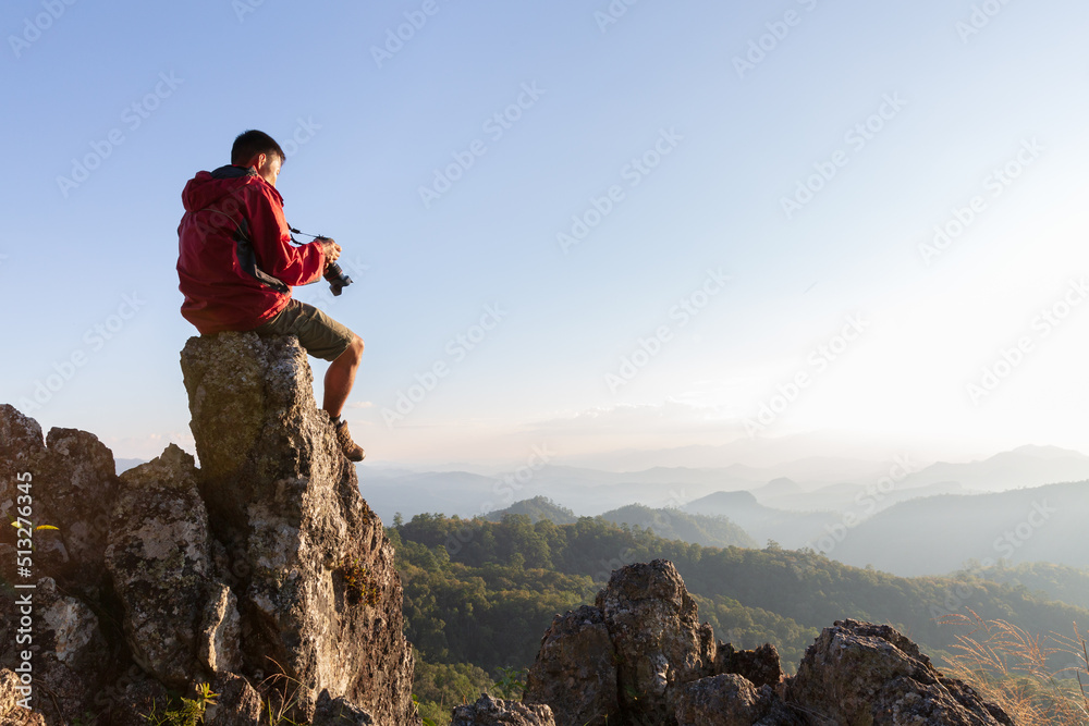 Obraz premium Happy people taking pictures of mountain scenery