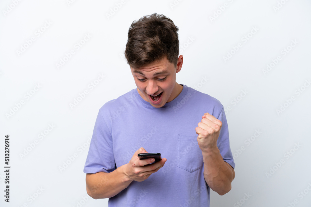Young handsome Brazilian man isolated on white background surprised and sending a message