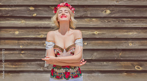 Woman in Slavic ethnic embroidered dress, flower wreath in hair. Concept of beauty Slavic women, Boho style