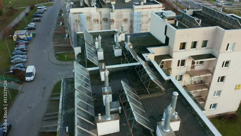 Drone shot on modern multi-apartment buildings with solar panels on the roofs. Drone shot on modern multi-apartment buildings with solar panels on the roofs.