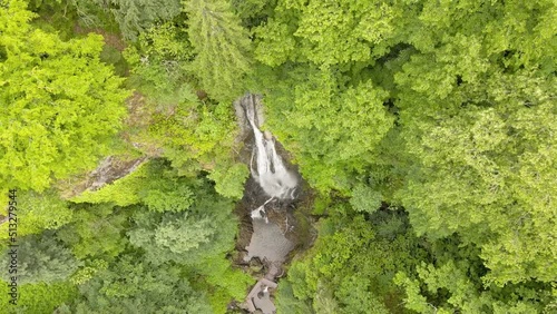 Drone shot of the waterfall Merisi. Drone shoots in a spiral. photo