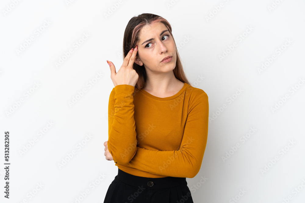 Young caucasian woman isolated on white background with problems making suicide gesture Young caucasian woman isolated on white background with problems making suicide gesture
