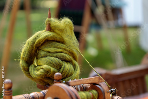 Medieval spinning wheel photo