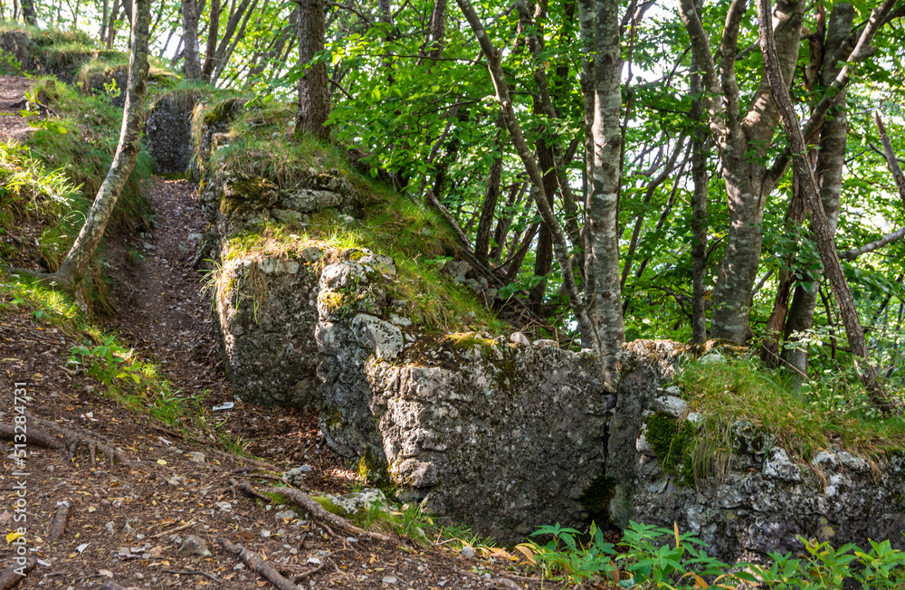 Ancient natural trenches of the First World War. Memorial Park, Molveno Village, Trentino Alto Adige, Italy, Europe Ancient natural trenches of the First World War. Memorial Park, Molveno Village, Trentino Alto Adige, Italy, Europe