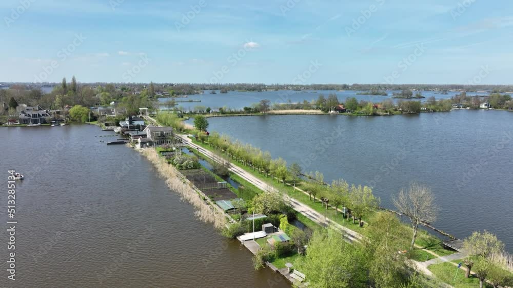 Typical dutch nature lake scenery at a sunny day. Reeuwijkse plannen in Holland. countryside natural outdoor lake river and green nature in spring. Recreation waterway scenic view. Typical dutch nature lake scenery at a sunny day. Reeuwijkse plannen in Holland. countryside natural outdoor lake river and green nature in spring. Recreation waterway scenic view.