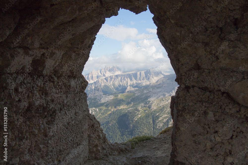 View of panoramic landscape from mountain tunnel window, Dolomites, Italian Alps.