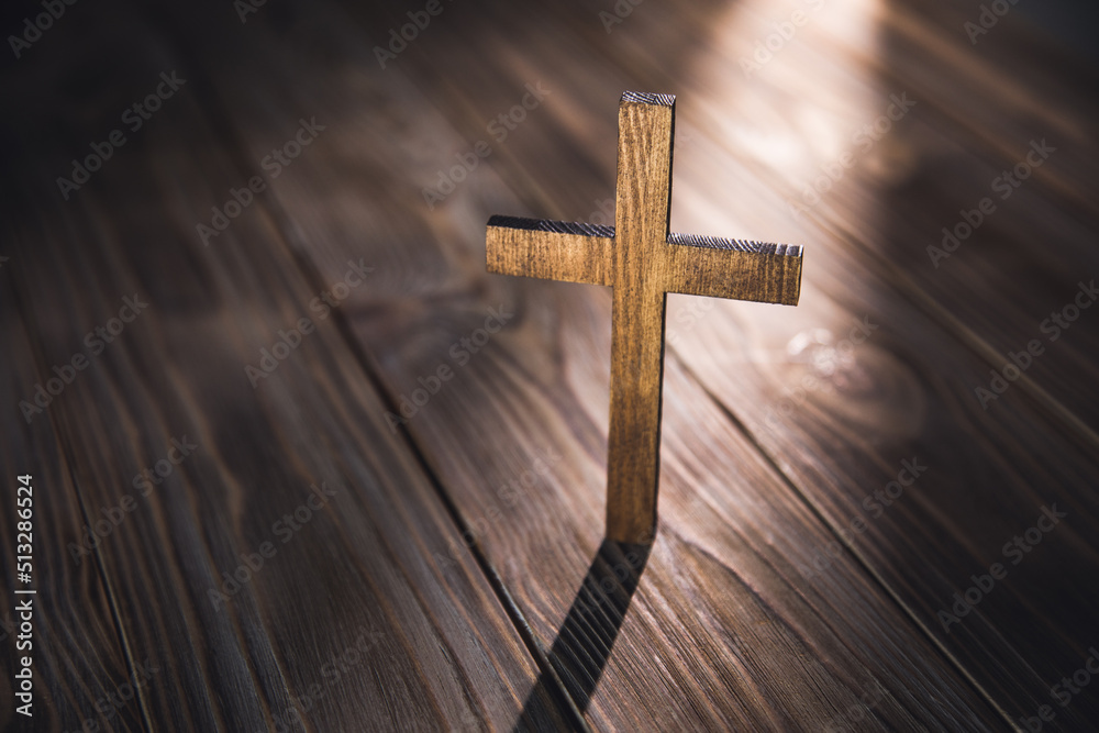 cross with on the old wooden floor