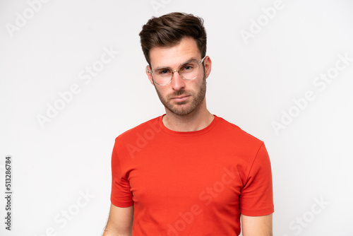 Young caucasian man isolated on white background With glasses
