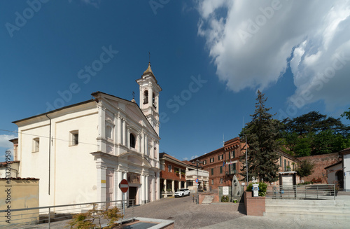 Sommariva del Bosco, Cuneo, Italy - May 01, 2022: Church of Sante Orsola ed Elisabetta or oratory of the humiliated (17th century) in Blood Donors street in the background the town hall