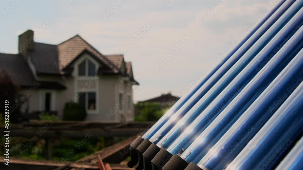 Vacuum collectors are a solar water heating system near the house ...