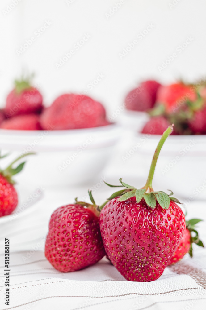 Fresh red strawberry close up on a white table. Fresh red strawberry close up on a white table.