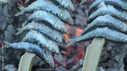 Sardines espetos skewers grilled at fire in a popular moraga photo