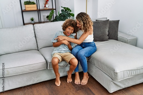 Принти на полотні Mother and son smiling confident make tickle at home