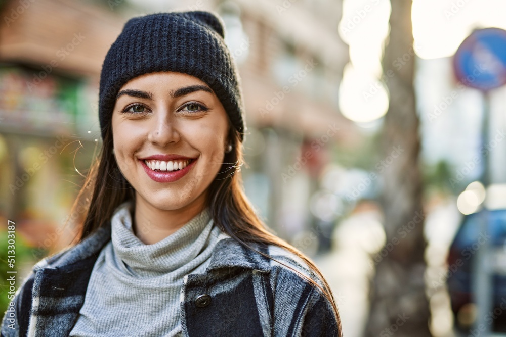 Young hispanic woman smiling happy standing at the city. Young hispanic woman smiling happy standing at the city.