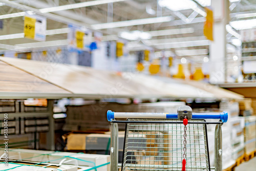 A shopping cart in a home improvement store © monticellllo