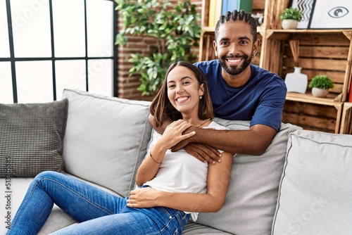 Man and woman couple smiling confident hugging each other at home