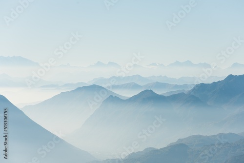 Obraz na plátně Beautiful shot of high white hilltops and mountains covered in fog