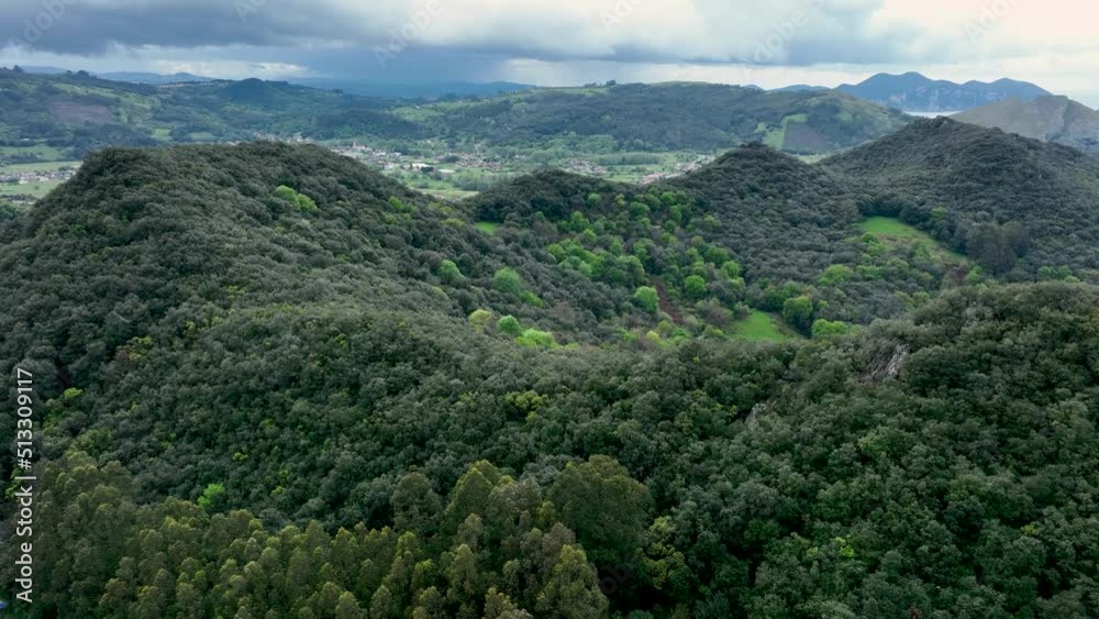 Landscape in spring seen from a drone of the surroundings of Mount Candina. In the Eastern Coastal Mountain, in the Cantabrian Sea. Liendo Valley, Cantabria, Spain, Europe Landscape in spring seen from a drone of the surroundings of Mount Candina. In the Eastern Coastal Mountain, in the Cantabrian Sea. Liendo Valley, Cantabria, Spain, Europe