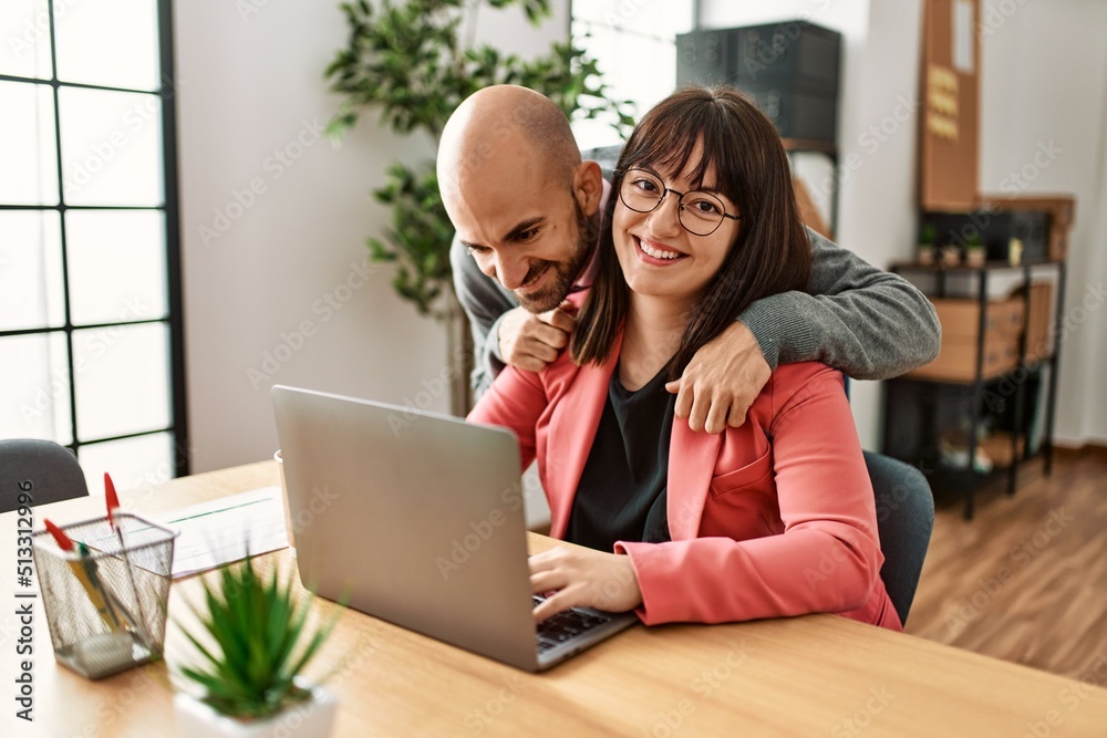 Two hispanic business workers smiling happy working at the office. Two hispanic business workers smiling happy working at the office.