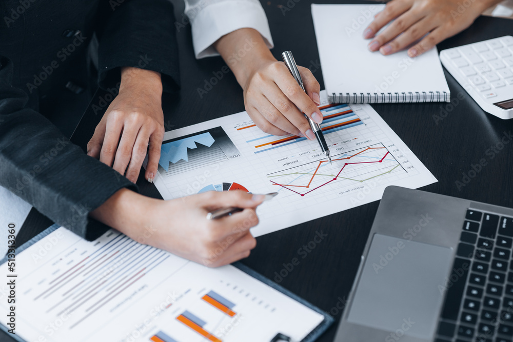 Two businessmen pointed to the material for the meeting, working together to plan to develop and solve common business problems. Concept of business management for growth and quality. Two businessmen pointed to the material for the meeting, working together to plan to develop and solve common business problems. Concept of business management for growth and quality.