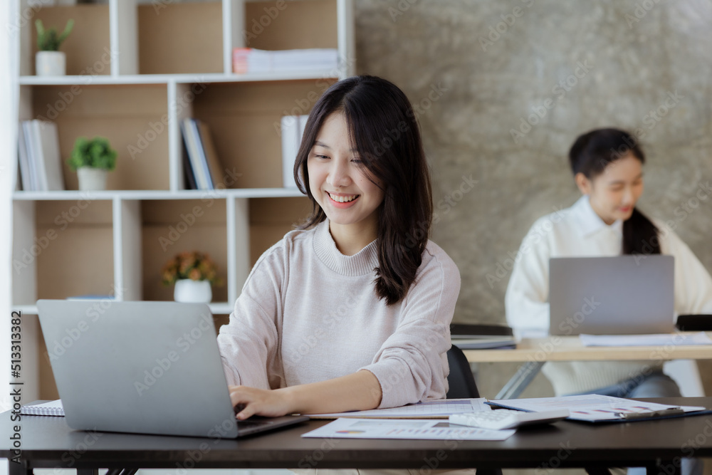 Asian women working in the office, young Asian business women as business executives, founding and running start-up executives, young female business leaders. Startup business concept. Asian women working in the office, young Asian business women as business executives, founding and running start-up executives, young female business leaders. Startup business concept.