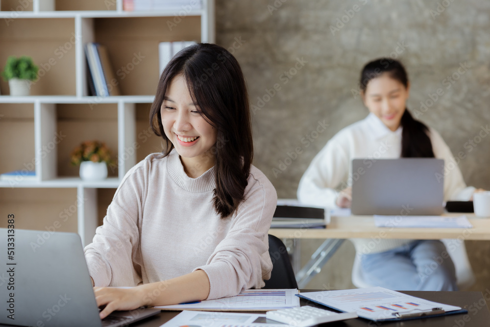 Asian women working in the office, young Asian business women as business executives, founding and running start-up executives, young female business leaders. Startup business concept. Asian women working in the office, young Asian business women as business executives, founding and running start-up executives, young female business leaders. Startup business concept.