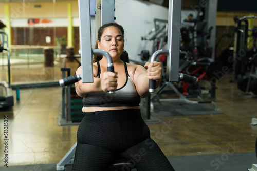 Attractive woman using a gym machine
