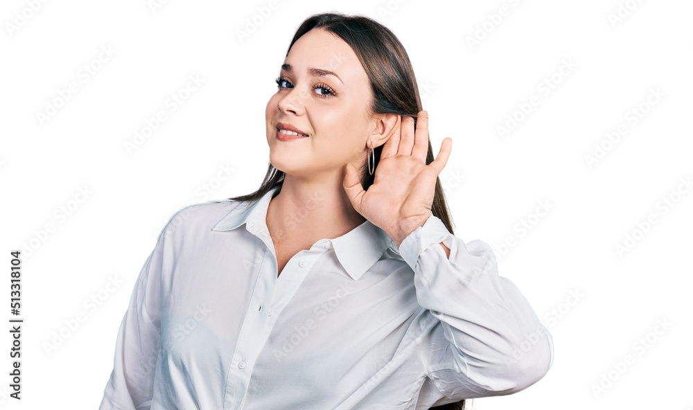 Young hispanic woman wearing casual clothes smiling with hand over ear listening and hearing to rumor or gossip. deafness concept. Young hispanic woman wearing casual clothes smiling with hand over ear listening and hearing to rumor or gossip. deafness concept.