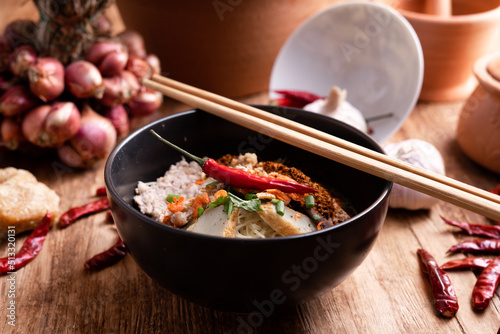 Thai Noodle , Bowl of noodles with spices on wooden background, Thai noodles soup, Table top view